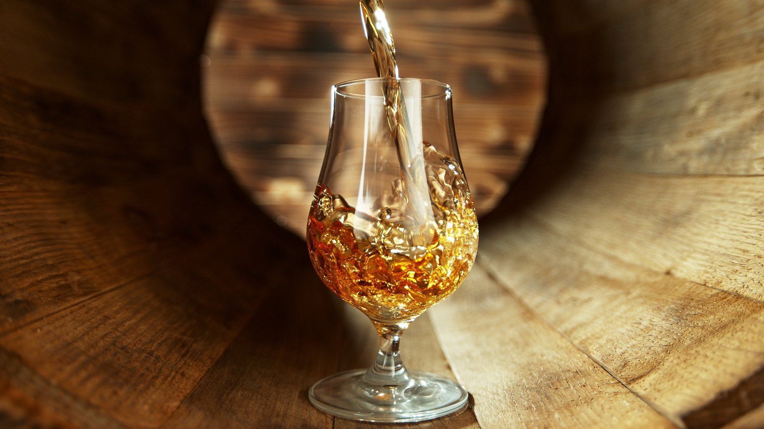 Pouring,Rum,Into,Glass,Inside,Old,Wooden,Barrel.,Concept,Of