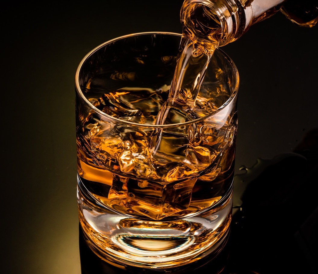 Glass,Of,Whiskey,On,Black,Background